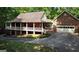 Spacious brick home with an expansive covered porch and a two-car garage at 31 Butler Bridge Dr, Mcdonough, GA 30252