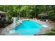 Backyard pool area featuring a slide, diving board, and an outdoor gazebo at 31 Butler Bridge Dr, Mcdonough, GA 30252