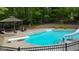 Backyard pool featuring a diving board, slide, and seating at 31 Butler Bridge Dr, Mcdonough, GA 30252