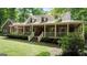 Charming brick home with a welcoming front porch and manicured lawn at 31 Butler Bridge Dr, Mcdonough, GA 30252