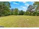 A huge grassy backyard backs up to a treeline for privacy at 155 Grandview Trce, Fayetteville, GA 30215