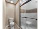 Bathroom with frosted glass shower enclosure, toilet and simple vanity at 155 Grandview Trce, Fayetteville, GA 30215