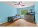 Bright bedroom with wood floors, dresser and window showcasing a tranquil space at 155 Grandview Trce, Fayetteville, GA 30215