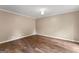 Inviting bedroom with wood-look floors, neutral walls, and ample natural light at 155 Grandview Trce, Fayetteville, GA 30215