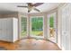Bright dining area with natural light, leading to an outdoor patio and ample space for entertaining at 155 Grandview Trce, Fayetteville, GA 30215