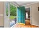 A peek into the foyer featuring hardwood floors and a bright green door at 155 Grandview Trce, Fayetteville, GA 30215