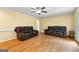 Spacious living room with hardwood floors, leather furniture, and bright lighting at 155 Grandview Trce, Fayetteville, GA 30215