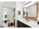 Modern bathroom with stylish vanity, framed mirror, and soaking tub at 109 Old Virginia Cir, Jonesboro, GA 30236