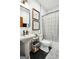 Well-lit bathroom featuring modern fixtures, hexagon tile floors and stylish shower curtain at 109 Old Virginia Cir, Jonesboro, GA 30236