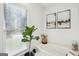 Bright bathroom featuring a soaking tub and natural light at 109 Old Virginia Cir, Jonesboro, GA 30236