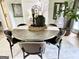 Dining room with round wood table and stylish chairs with decor at 109 Old Virginia Cir, Jonesboro, GA 30236