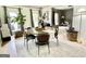 Dining room with a round table, modern chairs, hardwood floors, and natural light at 109 Old Virginia Cir, Jonesboro, GA 30236