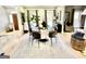 Bright dining room with round table, modern decor, and hardwood floors at 109 Old Virginia Cir, Jonesboro, GA 30236