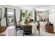 Spacious dining area featuring a round table and large windows providing ample natural light at 109 Old Virginia Cir, Jonesboro, GA 30236