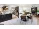 Bright dining room with hardwood floors, round table, and modern decor accents at 109 Old Virginia Cir, Jonesboro, GA 30236