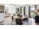 Light-filled dining area features a round table, gray drapes, and views to the outdoors at 109 Old Virginia Cir, Jonesboro, GA 30236