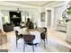 Open dining room and living area featuring modern decor, hardwood floors, and natural light at 109 Old Virginia Cir, Jonesboro, GA 30236