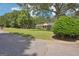 Well-maintained lawn of a single-story brick home with mature landscaping, featuring a covered front porch at 109 Old Virginia Cir, Jonesboro, GA 30236