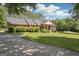 Single-story brick home with a well-manicured lawn, covered front porch, and mature landscaping at 109 Old Virginia Cir, Jonesboro, GA 30236
