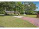 Well-maintained home with a brick driveway, lush lawn, and mature landscaping, offering great curb appeal at 109 Old Virginia Cir, Jonesboro, GA 30236
