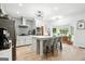 Bright kitchen with a large island, stylish lighting, and stainless steel appliances at 109 Old Virginia Cir, Jonesboro, GA 30236