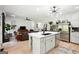 Modern eat-in kitchen featuring island, stainless steel appliances, open shelving and hardwood floors at 109 Old Virginia Cir, Jonesboro, GA 30236