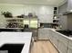 Well-lit kitchen features stainless steel appliances, granite countertops, and white cabinets at 109 Old Virginia Cir, Jonesboro, GA 30236