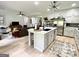 Bright kitchen with island seating, stainless steel appliances, light cabinets, and open floor plan at 109 Old Virginia Cir, Jonesboro, GA 30236