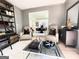 Elegant living room features neutral tones, stylish furniture, and a seamless transition to the dining area at 109 Old Virginia Cir, Jonesboro, GA 30236