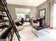 Bright living room features designer decor and access to dining room at 109 Old Virginia Cir, Jonesboro, GA 30236