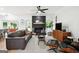 Cozy living room features a black brick fireplace, leather sofa, and stylish decor at 109 Old Virginia Cir, Jonesboro, GA 30236