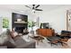 Comfortable living room with brick fireplace, ceiling fan, and stylish modern decor at 109 Old Virginia Cir, Jonesboro, GA 30236