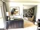 Open-concept living room with modern décor, art, and hardwood floors at 109 Old Virginia Cir, Jonesboro, GA 30236