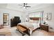 Comfortable main bedroom with coffered ceiling, hardwood floors and neutral decor at 109 Old Virginia Cir, Jonesboro, GA 30236