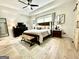A spacious main bedroom offers an inviting view of comfort with an accent rug and ceiling fan at 109 Old Virginia Cir, Jonesboro, GA 30236