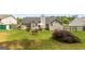 Large backyard featuring mature lawn, patio seating, and backyard with room for entertaining and relaxing at 12 Connie Trl, Grantville, GA 30220
