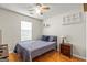 Bedroom with modern decor featuring a bed with wood flooring and a ceiling fan at 12 Connie Trl, Grantville, GA 30220