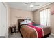 Cozy bedroom featuring neutral colored walls, carpet flooring, and a ceiling fan at 12 Connie Trl, Grantville, GA 30220
