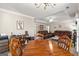 Open concept dining and living areas featuring hardwood furniture and decor, and natural lighting at 12 Connie Trl, Grantville, GA 30220