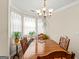 Dining room features a wood table and chairs with natural light and decor at 12 Connie Trl, Grantville, GA 30220