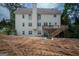 The back of the home with a deck is set against a naturally landscaped, expansive backyard at 105 Kellens Ct, Fayetteville, GA 30215