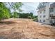 Expansive backyard with a blank slate, ready for landscaping or outdoor activities; a natural retreat at 105 Kellens Ct, Fayetteville, GA 30215