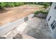 Concrete patio with brick retaining wall, and views of the backyard and home's exterior at 105 Kellens Ct, Fayetteville, GA 30215