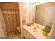 Bright bathroom featuring vanity, mirror, sink and a shower/tub combo at 105 Kellens Ct, Fayetteville, GA 30215