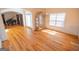 Bright dining room with hardwood floors, elegant chandelier, and a glimpse into the music room, perfect for entertaining at 105 Kellens Ct, Fayetteville, GA 30215