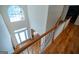 Bright foyer boasts a high ceiling, arched window, and hardwood floors at 105 Kellens Ct, Fayetteville, GA 30215