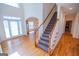 Inviting foyer with hardwood floors, staircase, and bright, airy feel, creating a warm welcome at 105 Kellens Ct, Fayetteville, GA 30215