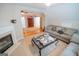 Cozy living room boasts a fireplace, comfortable seating, and access to other rooms at 105 Kellens Ct, Fayetteville, GA 30215