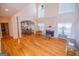 Open-concept living room with soaring ceilings, fireplace, and view into kitchen making it ideal for Gathering gatherings at 105 Kellens Ct, Fayetteville, GA 30215
