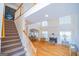 Spacious living room with fireplace, hardwood floors, and staircase at 105 Kellens Ct, Fayetteville, GA 30215